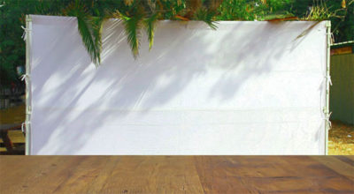 Jewish festival of Sukkot. Traditional succah (hut). Empty wooden old table for product display and presentation
